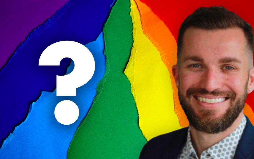 Queer Jewish Rabbi Steven Philp over rainbow construction paper with a question mark by his head.