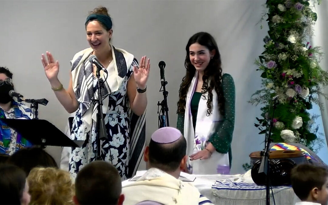 Rabbi Deena models priestly hand spreading — which may look something like the Vulcan Salute — before giving a drash on keeping kosher.